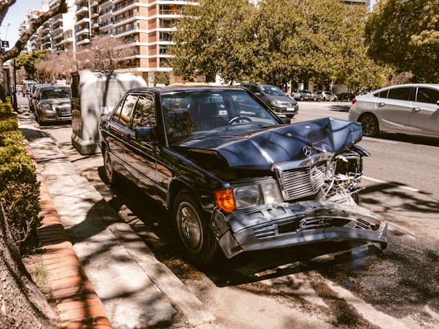 Car After Road Traffic Accident With Male Driver Suffering Whiplash Injury