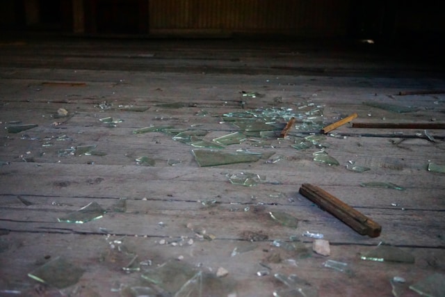 Broken glass on floor is a hazard to others
